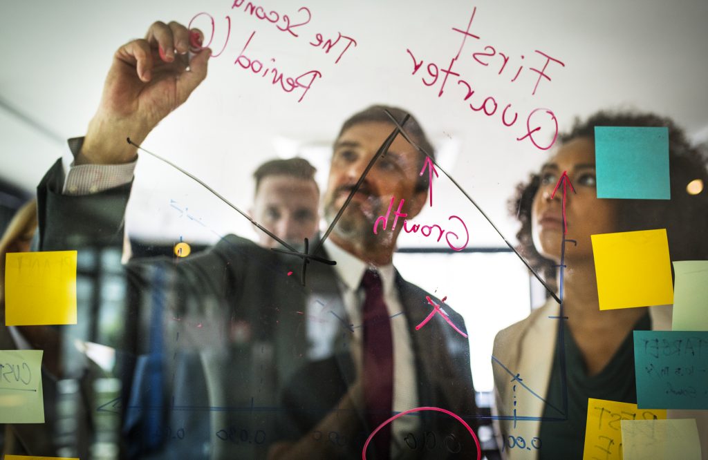 Image of a team ideating for the blog - How do you build successful product engineering teams?